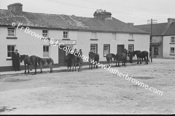 FAIR SCENE  HORSES OUTSIDE MARKET BAR